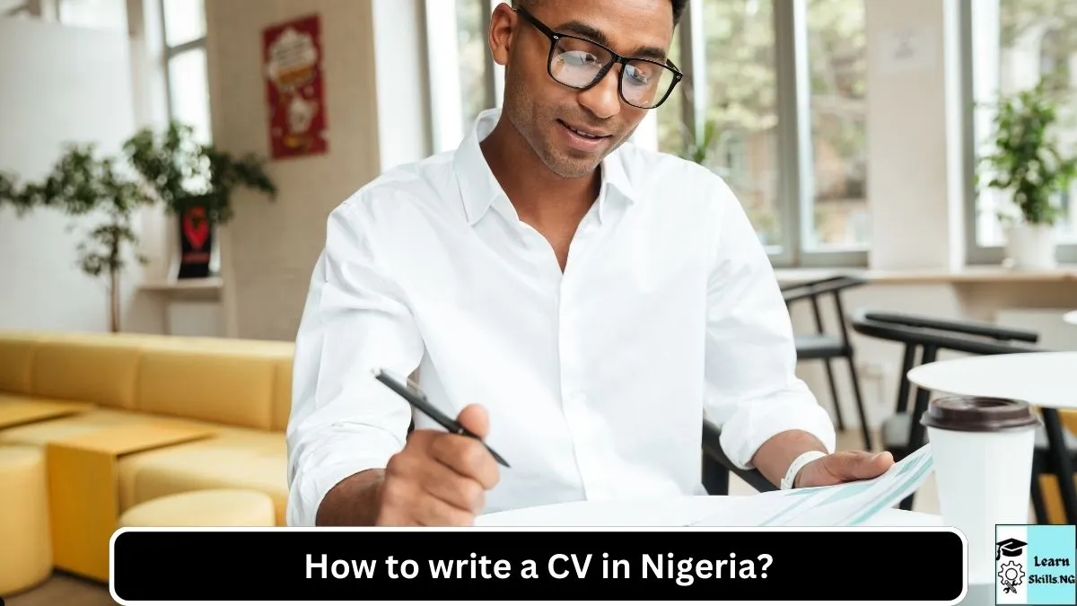 Image of young Nigerian writing his CV