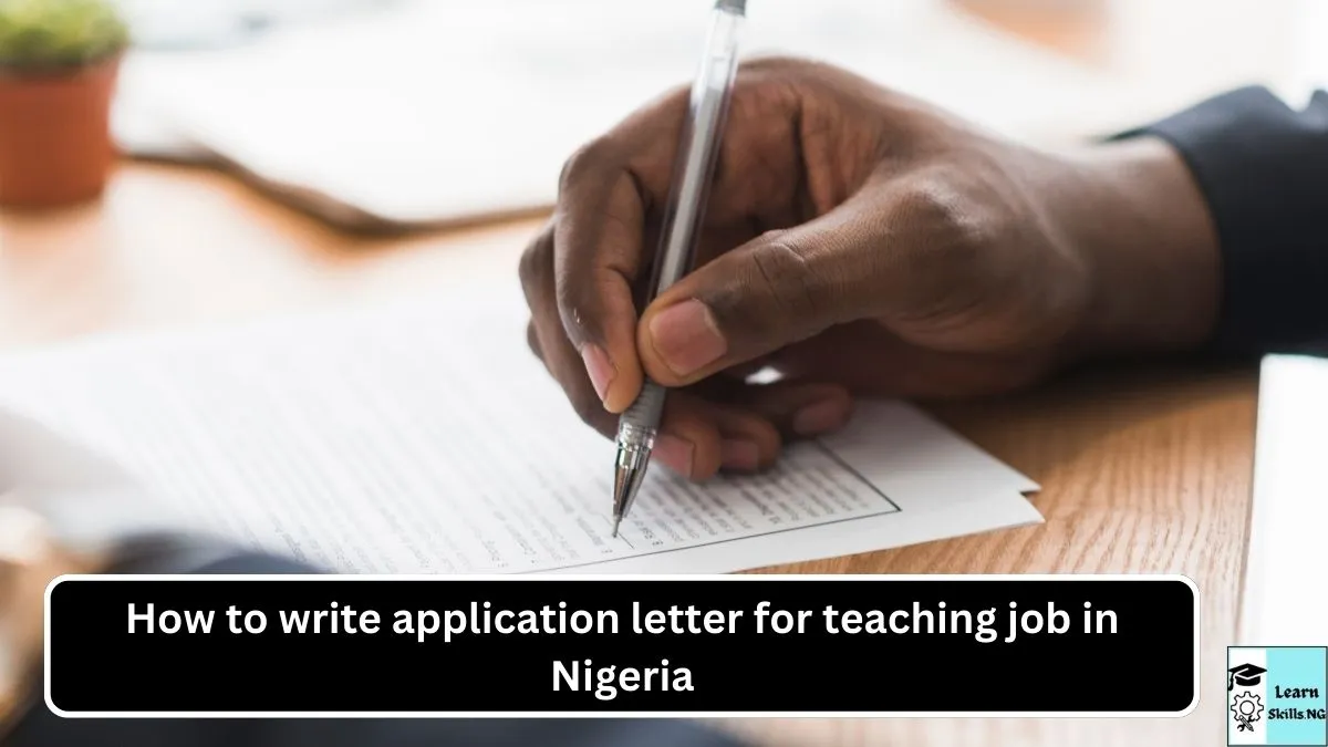 image of a person's hand writing a letter